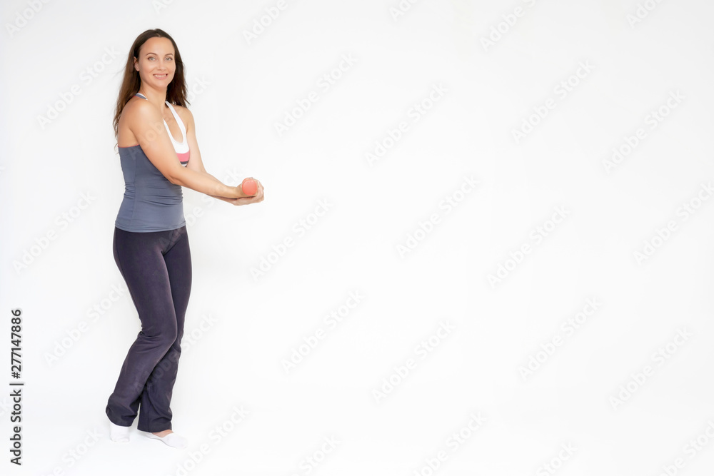 Full-length portrait on white background of beautiful pretty fitness girl woman in sports uniform, sitting on the stairs with different emotions in different poses. Stylish trendy youth. Full-length portrait on white background of beautiful pretty fitness girl woman in sports uniform, sitting on the stairs with different emotions in different poses. Stylish trendy youth.