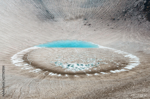 Ice lake in the crater of Gorely volcano, Kamchatka, Russia photo