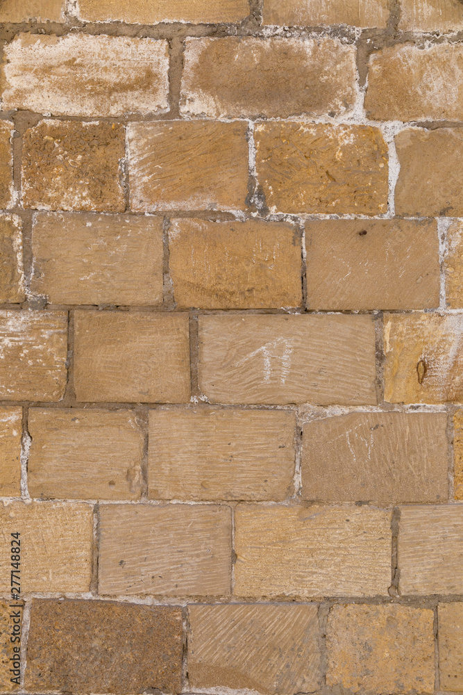 Naklejka premium The texture of the old wall of large bricks