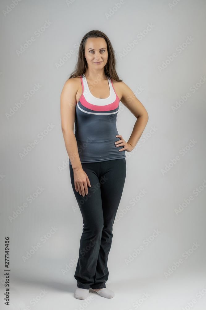 Horizontal portrait full length on white background beautiful pretty fitness girls women in fashionable sportswear with different emotions in different poses. Stylish trendy youth.