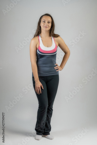 Horizontal portrait full length on white background beautiful pretty fitness girls women in fashionable sportswear with different emotions in different poses. Stylish trendy youth.