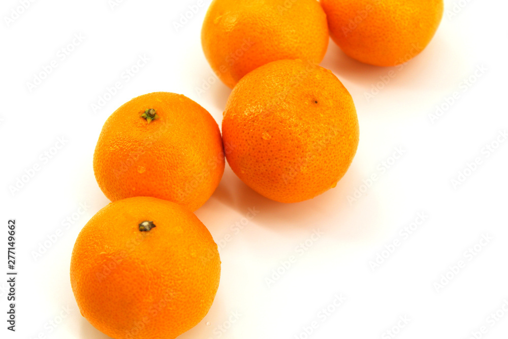 White background, fresh tangerines, five pieces White background, fresh tangerines, five pieces