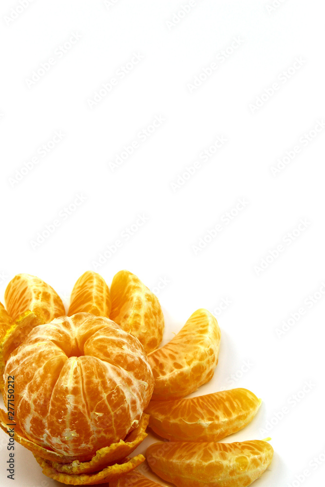 Peeled tangerines lie on a white background Peeled tangerines lie on a white background