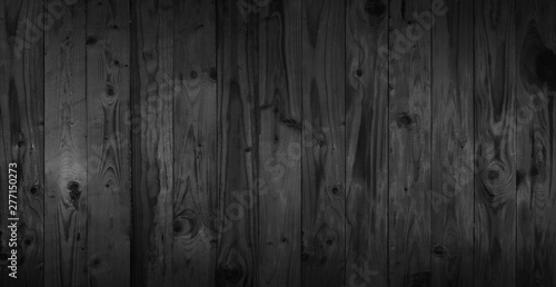 Black wood texture background coming from natural tree. Dark black Wooden panel with beautiful patterns. Space for work