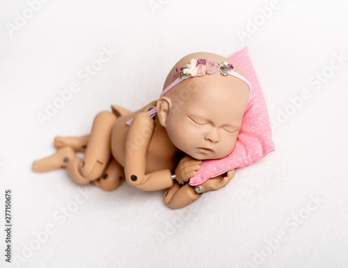 Doll of newborn for photo practicing