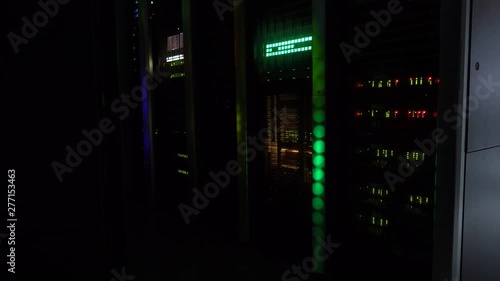 In the dark. A working supercomputer. Server room. video contains noise and fliker. photo