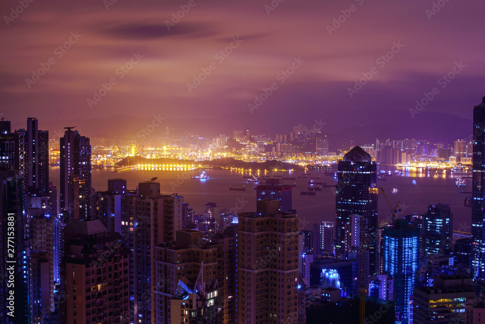 Famous view of Hong Kong at twilight sunset, sunrise. Hong Kong skyscrapers skyline cityscape illuminated in the evening. Hong Kong, special administrative region in China. China shopping market. Blue