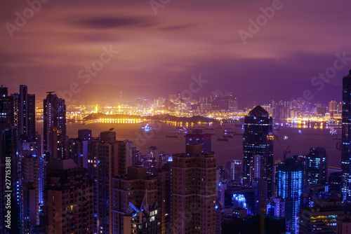 Famous view of Hong Kong at twilight sunset  sunrise. Hong Kong skyscrapers skyline cityscape illuminated in the evening. Hong Kong  special administrative region in China. China shopping market. Blue