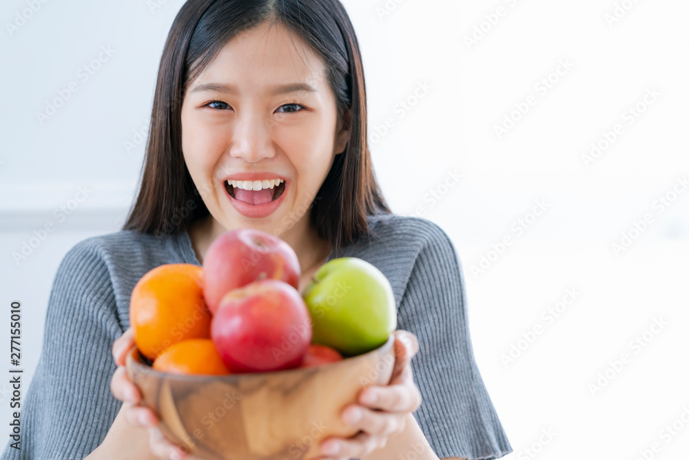 healthy and beautiful asian woman smile happiness with bowl of fresh fruit diet and eat good nutrition healthy ideas concept healthy and beautiful asian woman smile happiness with bowl of fresh fruit diet and eat good nutrition healthy ideas concept