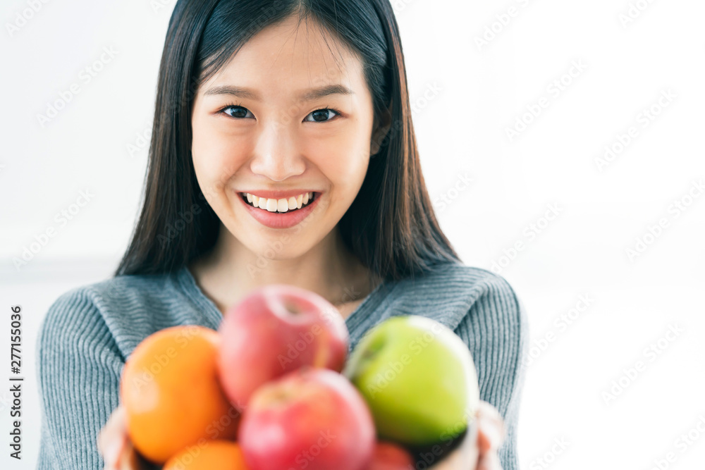healthy and beautiful asian woman smile happiness with bowl of fresh fruit diet and eat good nutrition healthy ideas concept healthy and beautiful asian woman smile happiness with bowl of fresh fruit diet and eat good nutrition healthy ideas concept