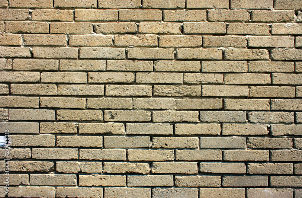 Obraz premium Stary, zniszczony mur z szarych cegieł - tło w stylu wabi-sabi