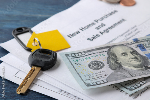 Wallpaper Mural new home purchase and sale agreement. Key with keyring and blank and money on a blue wooden table. concept of buying a home. Torontodigital.ca