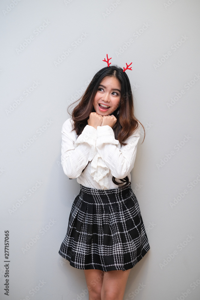 Asian girl with nice outfit, short skirt and long sleeve shirt Stock Photo  | Adobe Stock