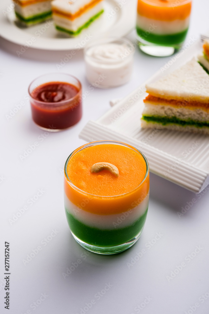 Tiranga / Tricolour sweet food made using indian flag colours and served in a glass in layers. selective focus