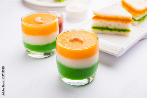 Obraz na plátně Tiranga / Tricolour sweet food made using indian flag colours and served in a glass in layers