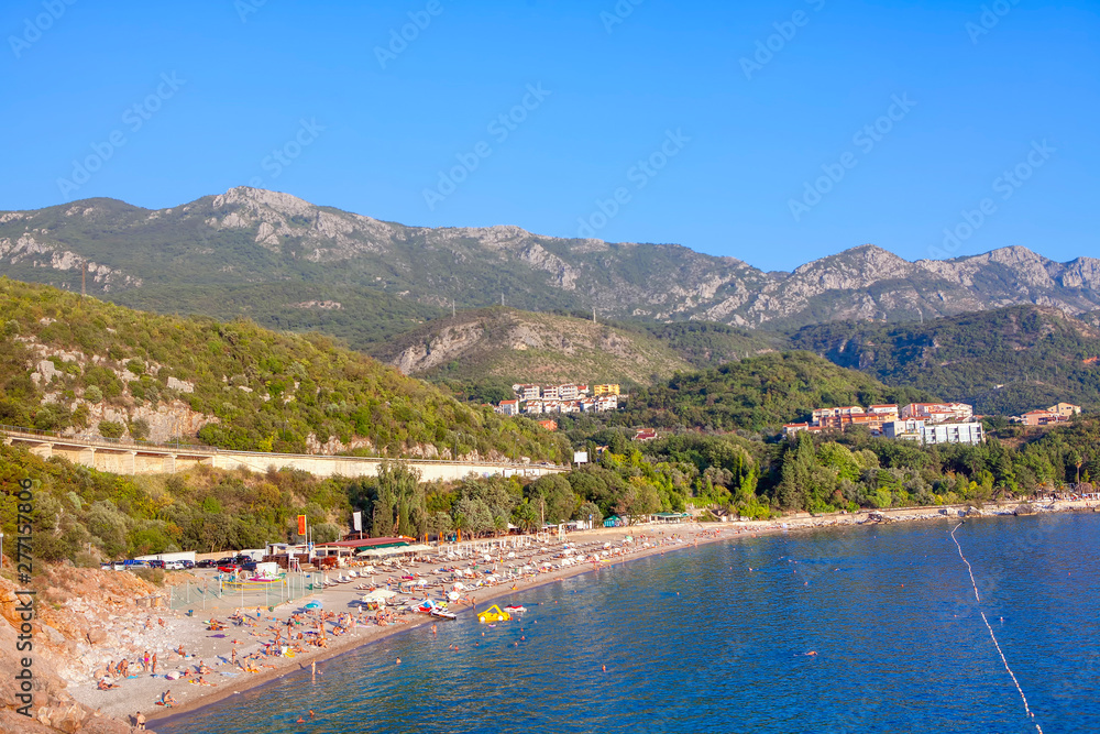 Adriatic coast , people on the sunny beach in Montenegro