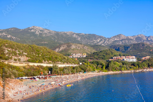 Adriatic coast , people on the sunny beach in Montenegro