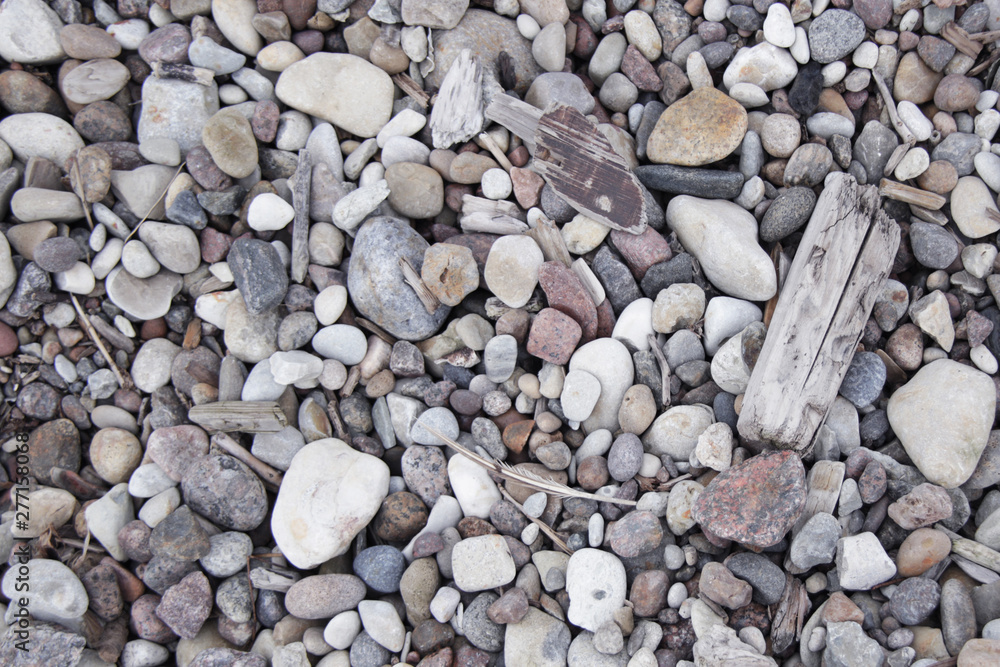 small grey white pink pebbles on the beach background small grey white pink pebbles on the beach background