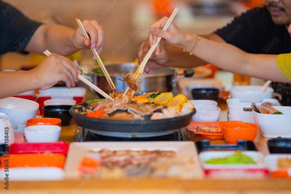 Selective focus Enjoy of Shabu Shabu and Sukiyaki, Japanese food with grill and pot boil