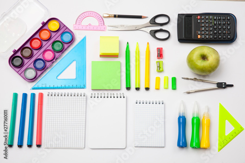 Preparation of primary school children. Bright and multicolored school background with stationery accessories for the study of general subjects. Flat Lay, Copy space, place for text.