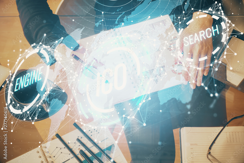 Cryptocurrency hologram over woman's hands writing background. Concept of blockchain. Double exposure Cryptocurrency hologram over woman's hands writing background. Concept of blockchain. Double exposure