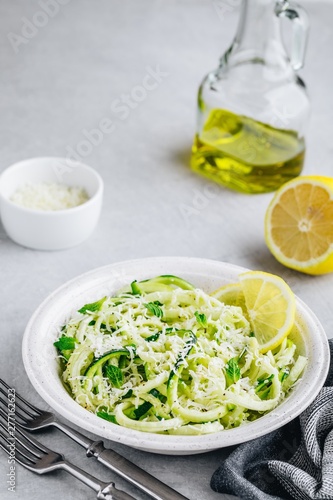 Green vegetarian pasta. Spiralized zucchini noodles with mint, lemon and parmesan cheese