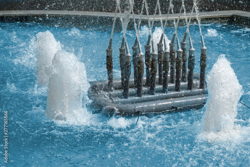 Photos Closeup of fountain nozzles with water sprays and splashes