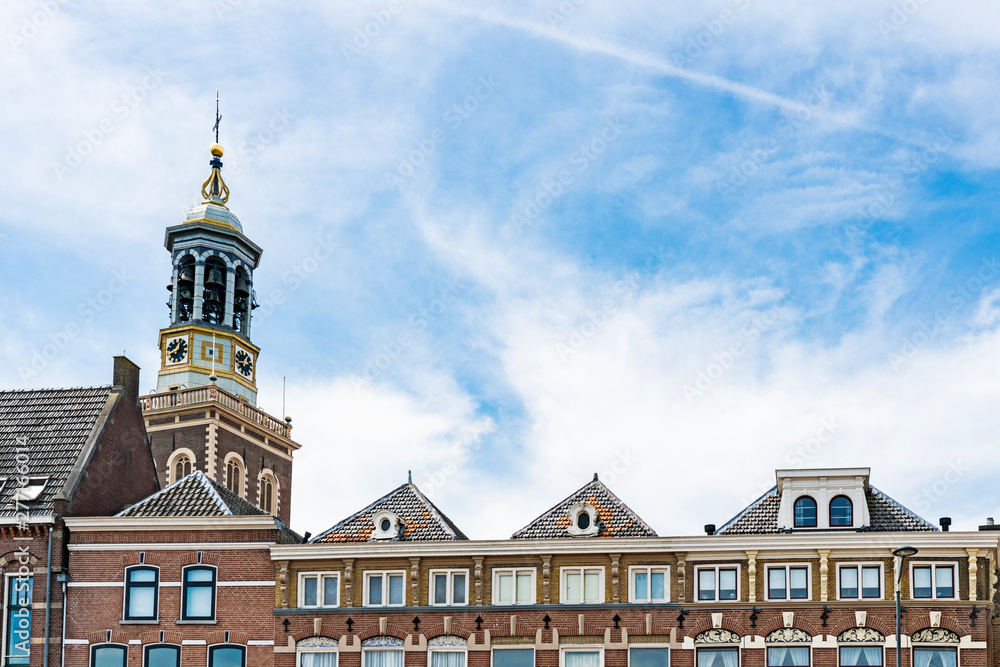 Fototapeta premium historical gate with carillon, called Nieuw Toren, in Kampen, The Netherlands. Blue sky, space for text
