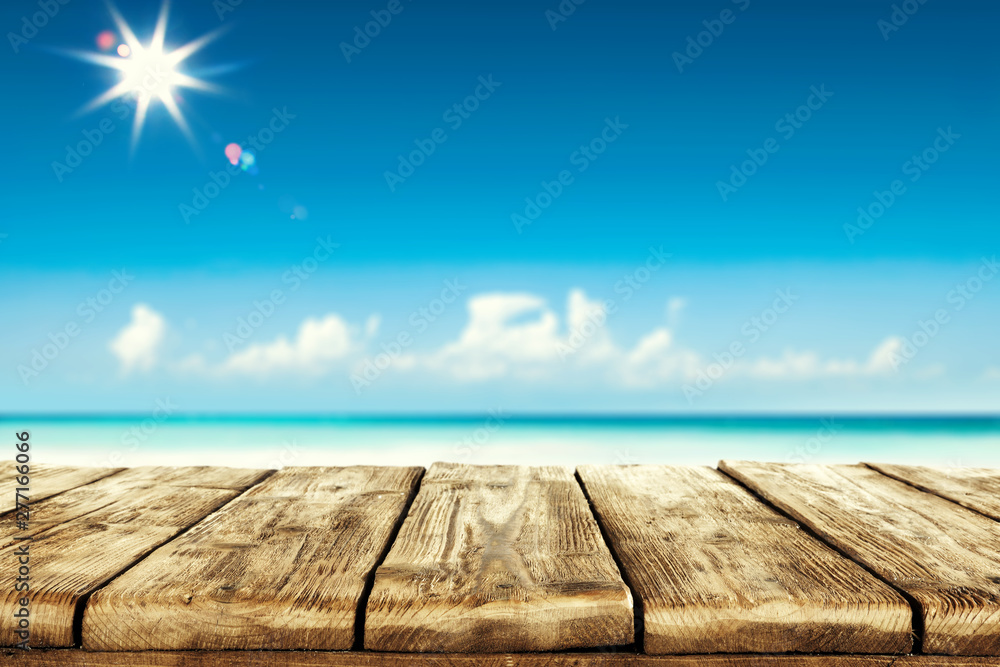 Desk of free space and summer beach background Desk of free space and summer beach background