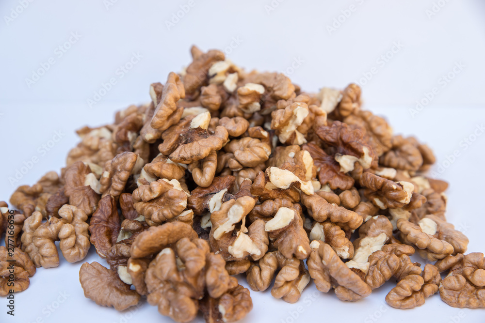 Pile of walnuts isolated on white background. Pile of walnuts isolated on white background.