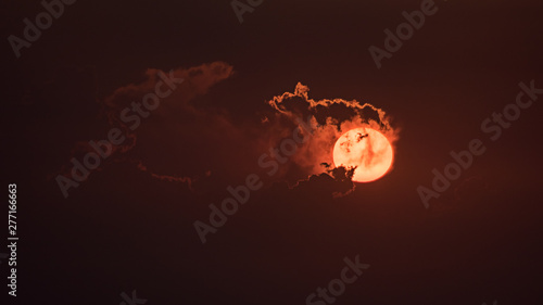 The red sun in the evening with cloud