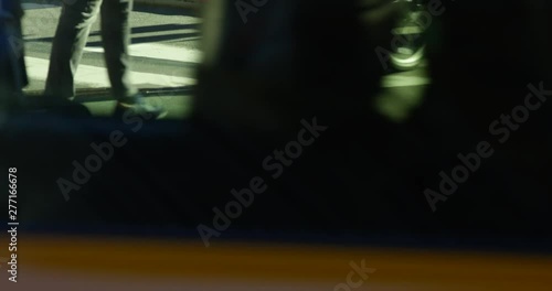Slow Motion Of Pedestrians Walking Across A Zebra Crossing Close up on Walking Feet Whilst Iconic NYC Yellow Cabs Drive Past