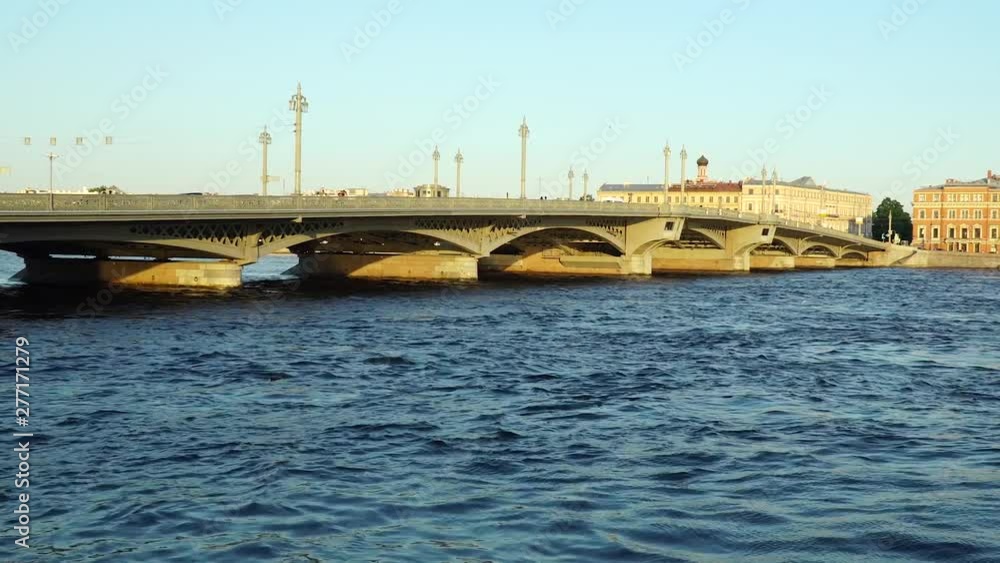 Panorama of the Neva River. Bridge and ancient buildings at sunset. Panorama of the Neva River. Bridge and ancient buildings at sunset.
