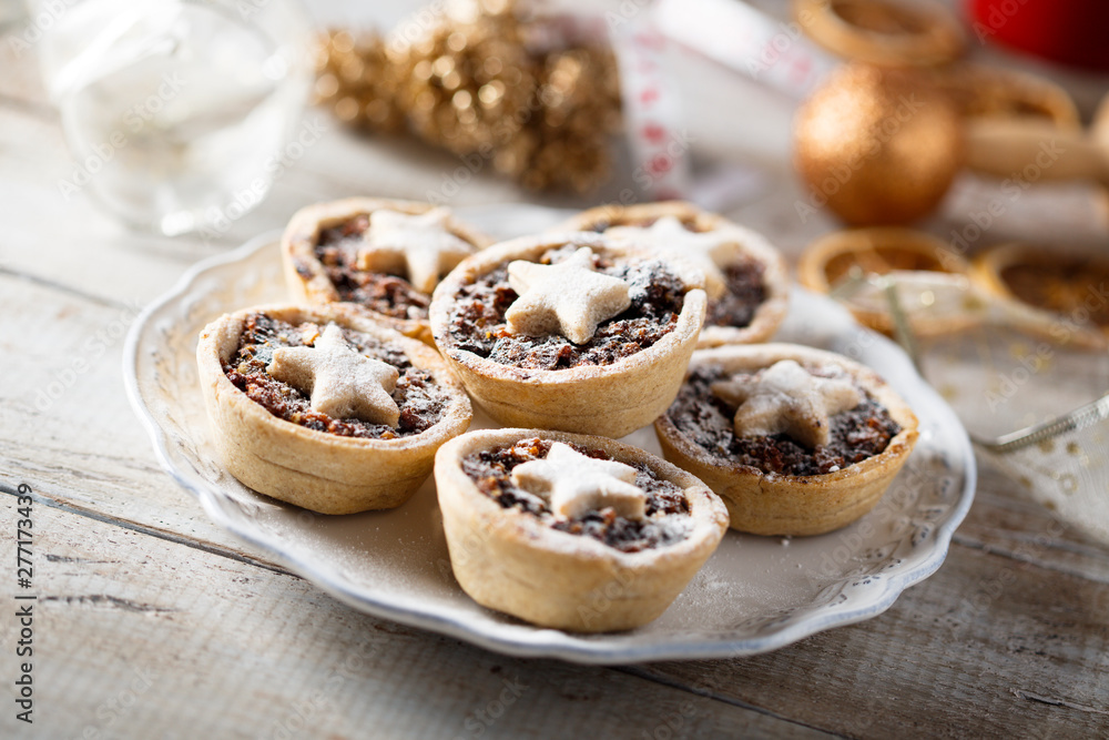 Homemade festive mince pies on white plate Homemade festive mince pies on white plate