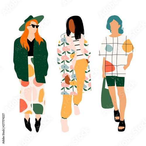 Three ladies dressed in trendy clothes standing in various poses. Fashion look.  Female faceless characters. Hand drawn colored vector set. All elements are isolated