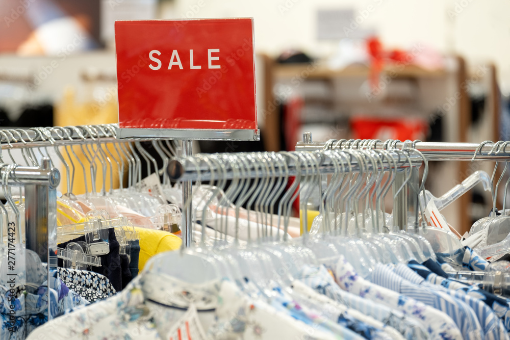 goods in stores and a red sign on sales discounts. mocap for text and concept of sales and trade in light industry goods in stores and a red sign on sales discounts. mocap for text and concept of sales and trade in light industry