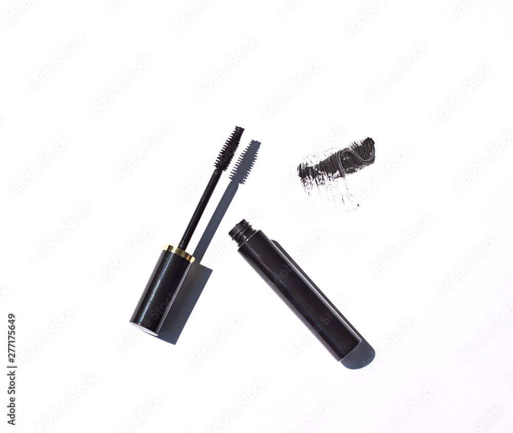 Black mascara close up with brush strokes on the white background. Cosmetic isolated product Black mascara close up with brush strokes on the white background. Cosmetic isolated product