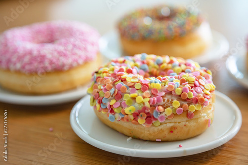 Doughnuts assorted on wood. Close up view