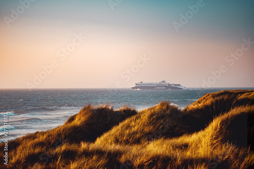 Colorline ferry heading to norway fron denmark with sand dunes and north sea ocean view. Hirtshals, North Jutland in Denmark, Europe - 13.07.2019