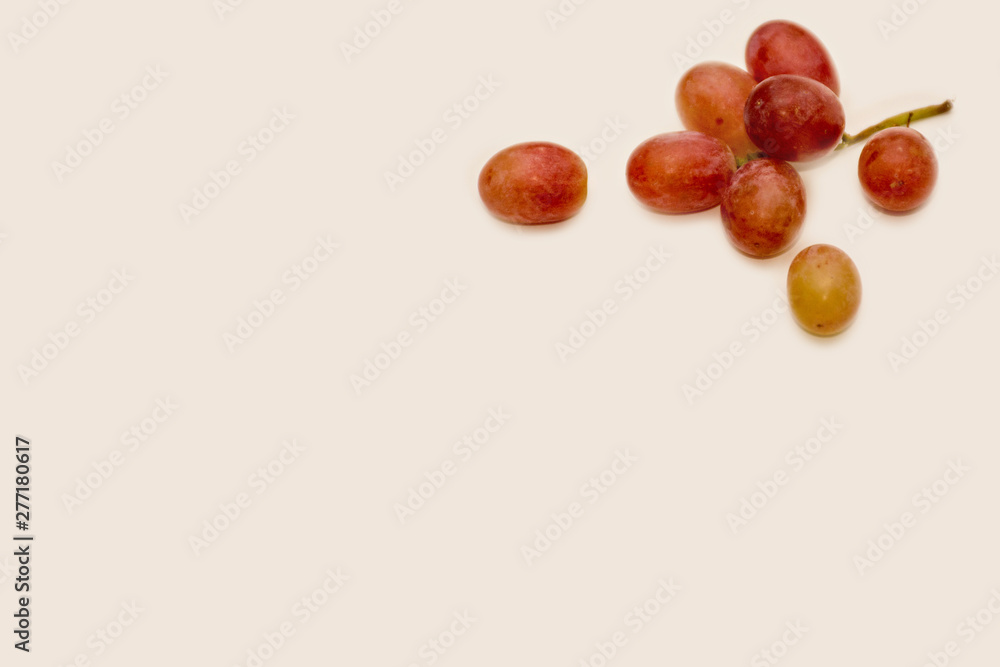 Red ripe grapes on neutral background Red ripe grapes on neutral background