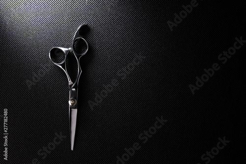 professional scissors on black background