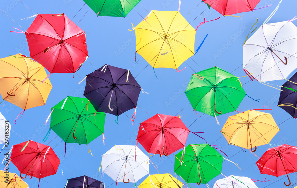 Summer mood with colorful umbrellas in the street