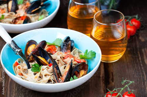 homemade pasta with mussels in tomato sauce