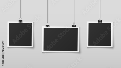 Hanging photo frames. Blank photos frame hangs on ropes with clips, wall memory, retro image memories album. Realistic vector design