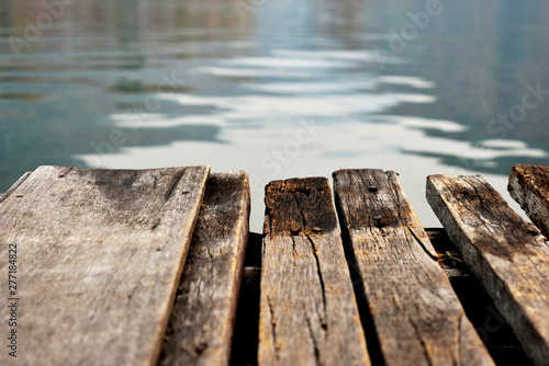 Wooden bridge for passenger boat landing in the reservoir