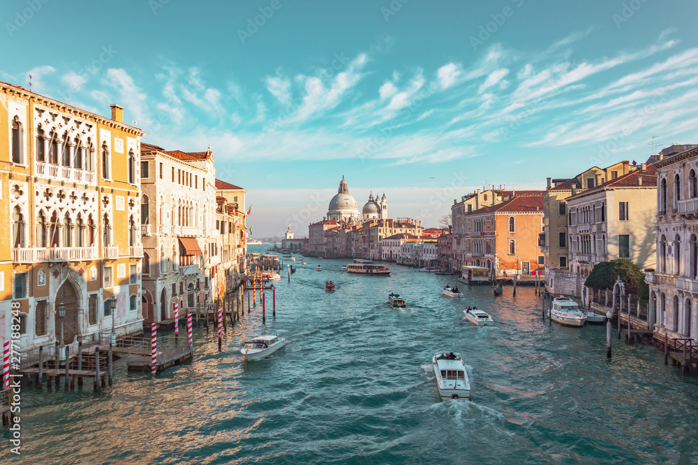 Grand Canal in Venice, Italy. View of the main street panorama of the major street of Venice, picturesque clouds in the sky. Basilica di Santa Maria della Salute.