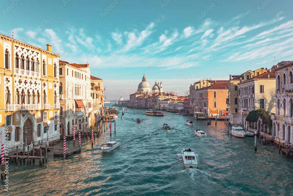 Obraz premium Grand Canal in Venice, Italy. View of the main street panorama of the major street of Venice, picturesque clouds in the sky. Basilica di Santa Maria della Salute.