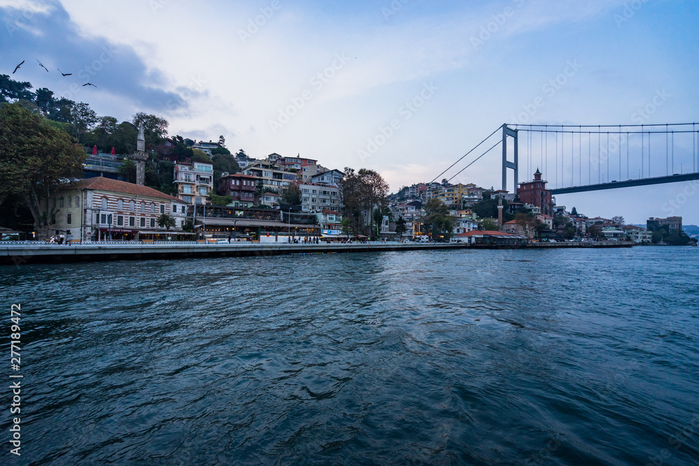 Istanbul cityscape from a ferry boat sailing the Bosphorus strait towards Fatih Sultan Mehmet Bridge (Second Bosphorus Bridge), Istanbul, Turkey