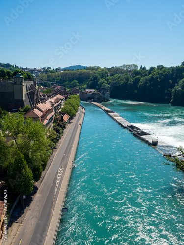 Bern, Switzerland - Jun 1st 2019: .The Aare river flows around three sides of the city of Bern. With its crystal-clear turquoise water