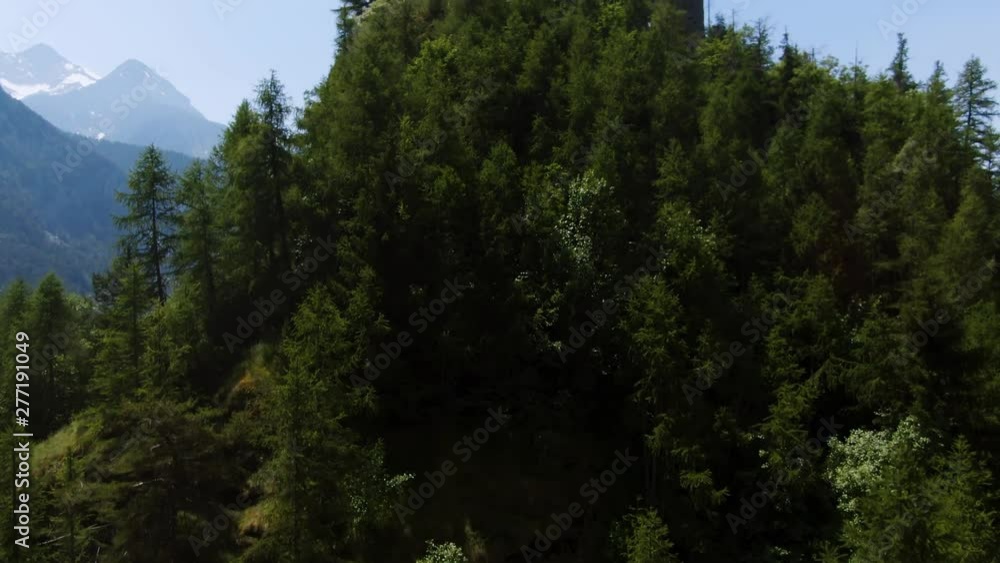 Aerial ascending revealing view of the castle of Graines, in Aosta valley, Italian Alps